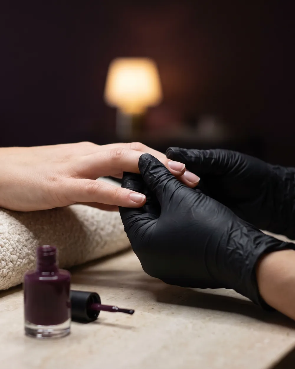 A manicure in progress at a stone desk